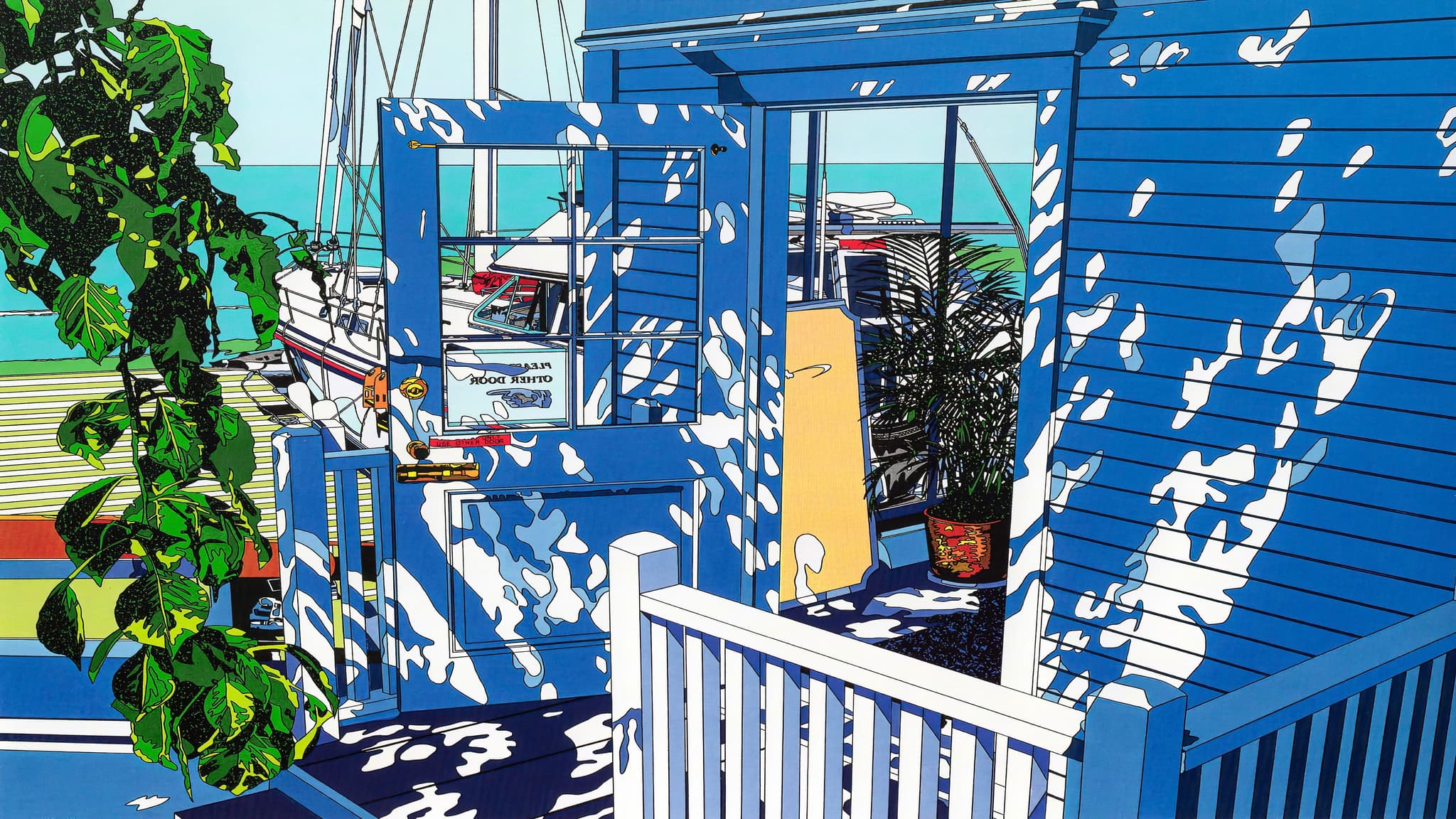 A vibrant seaside scene with a blue wooden structure, casting intricate shadows. Lush green plants and a glimpse of the ocean in the background create a serene atmosphere